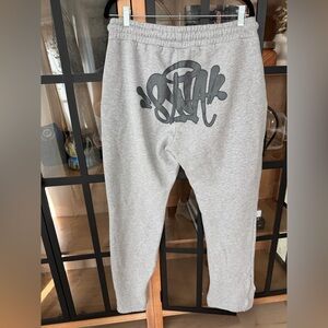 Syna World Logo joggers sweatpants tracksuit graffiti zipper drawstring